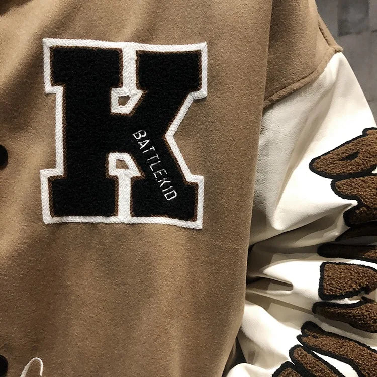 panel varsity outerwear, 2025 trend, for men, fall streetwear outfit, oversized style, layered fashion, modern aesthetic, graphic detail