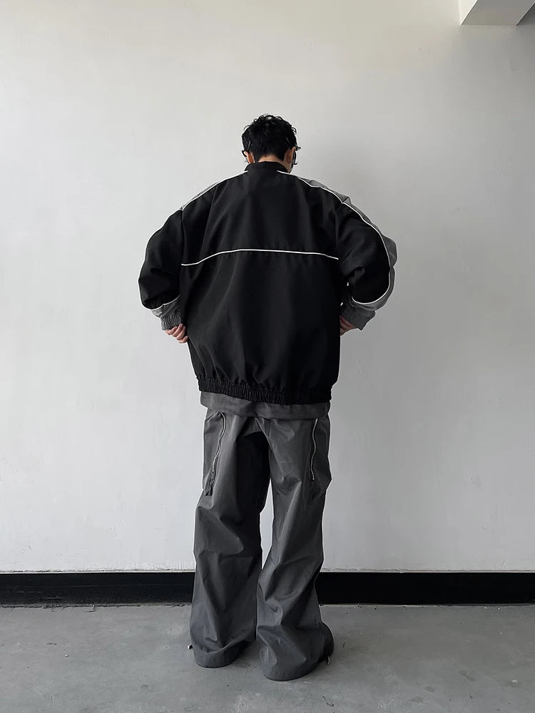 bold graphic coat, high-street look, for men, fall streetwear outfit, oversized style, layered fashion, modern aesthetic, graphic detail