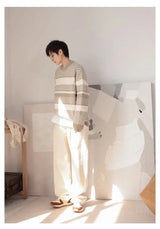 grunge knit sweater with heavyweight fabric, layered urban look for cold weather, street fashion menswear trend for seasonal 