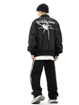 panel varsity outerwear, 2025 trend, for men, fall streetwear outfit, oversized style, layered fashion, modern aesthetic, graphic detail