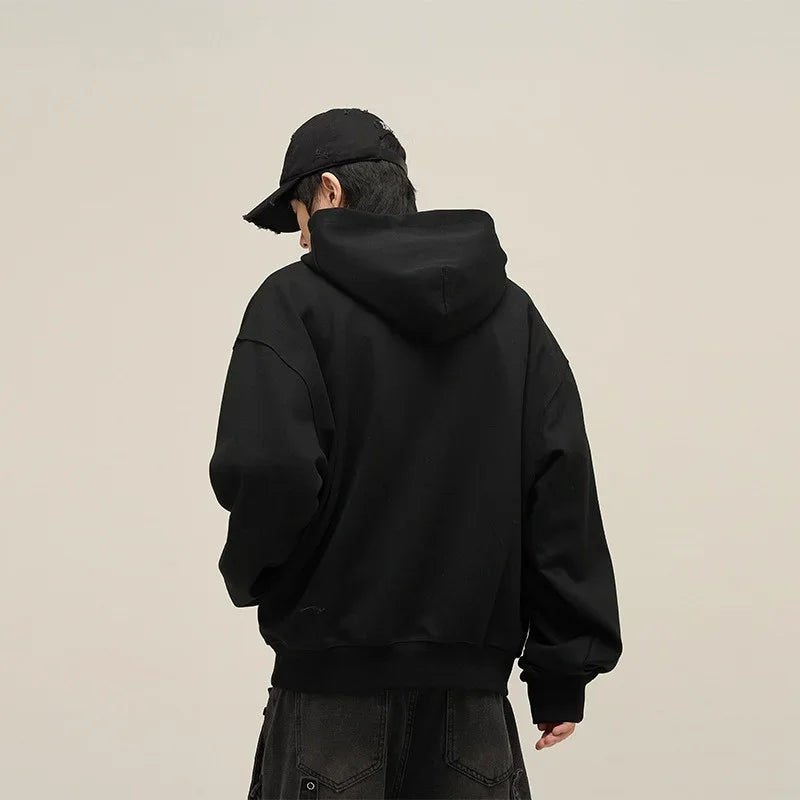 Minimalist black techwear hoodie with sleek design