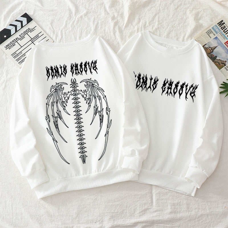 Oversized vintage hoodie with gothic and Y2K graphic design, relaxed streetwear silhouette, and retro urban aesthetic built for daily wear and layered outfits.