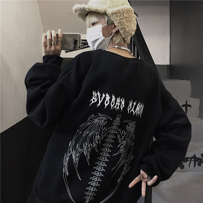 Oversized vintage hoodie with gothic and Y2K graphic design, relaxed streetwear silhouette, and retro urban aesthetic built for daily wear and layered outfits.
